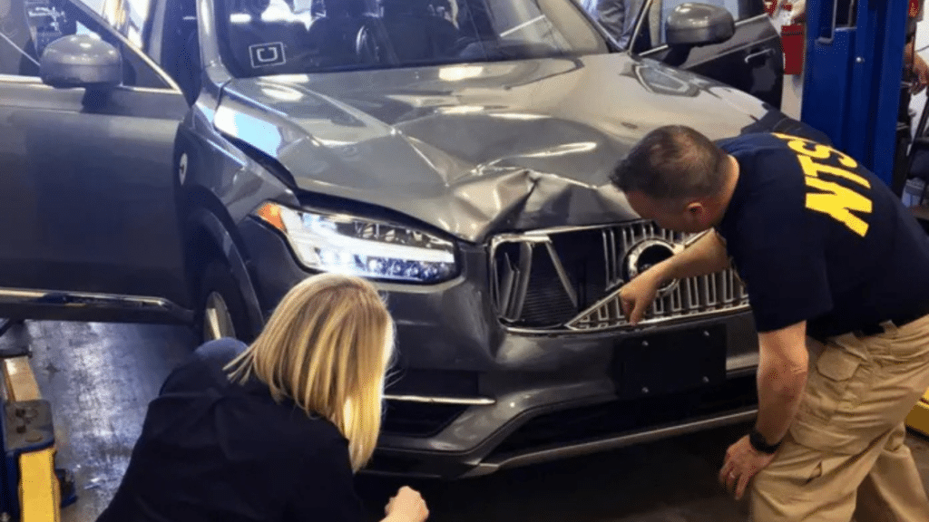 Self-driving vehicle accident depiction highlighting autonomous technology and backup driver context